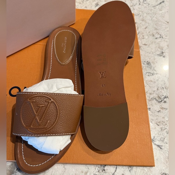 Louis Vuitton Shoes - NWT. Womens Louis Vuitton flats. Size 10. Never worn.